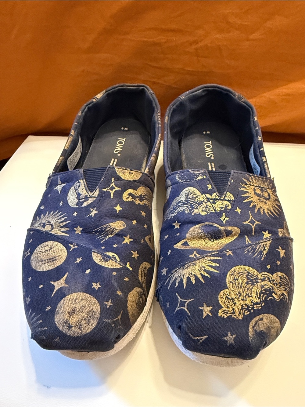 TOMS women’s sz 8 Navy Slip-On Sneakers with Gold Celestial Print
